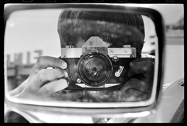 Petri camera reflecting in a car mirror Petri camera reflection in a car mirror
